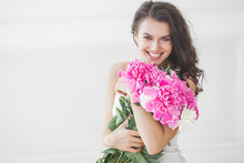 Close Up Portrait Of Young Beautiful Woman With Flowers Indoors