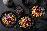 Fototapeta  - waffles with sour cream and berry sauce