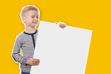 preschool child on yellow background with poster in hand