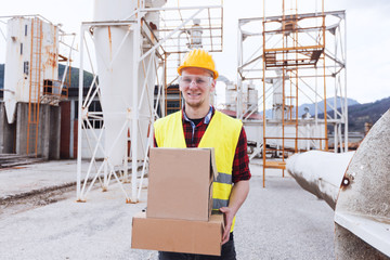 Wall Mural - Warehouse worker holding cardboard box 