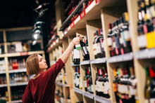 Photo Of Young Woman In Wine Shop