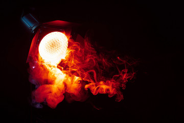 Red light with smoke in the dark. Equipment for photo Studio.