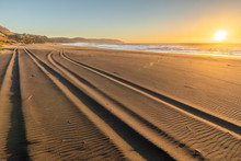 A 4WD Car Track In A Wild Beach Sand Going Towards An Endless Infinite Horizon At The Chilean Coastline In Puertecillo Beach, An Amazing Place For Visiting And Having A Wonderful Day, Chile