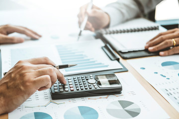 Fototapete - Co-working Business Team Consulting meeting Planning Strategy Analysis investment and saving concept. meeting discussing new plan financial graph data.