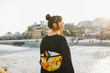 © Wataru Kitamura - Rear view of young woman with backpack standing outdoors