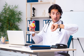 Young doctor cardiologist working in the clinic 