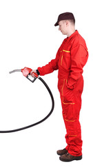 Wall Mural - Man gas station staff  is holding red gasoline pistol pump fuel nozzle