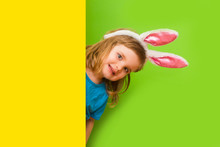 Cute Little Child Girl With Bunny Ears On Color Background. Happy Easter Day!