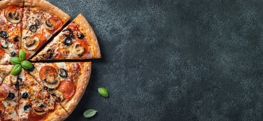 Tasty pepperoni pizza with mushrooms and olives.