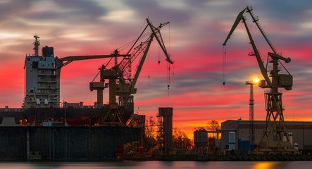 merchant ship in the dry dock of the repair yard