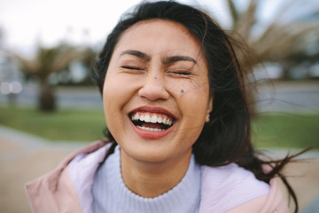 Close up of woman laughing outdoors