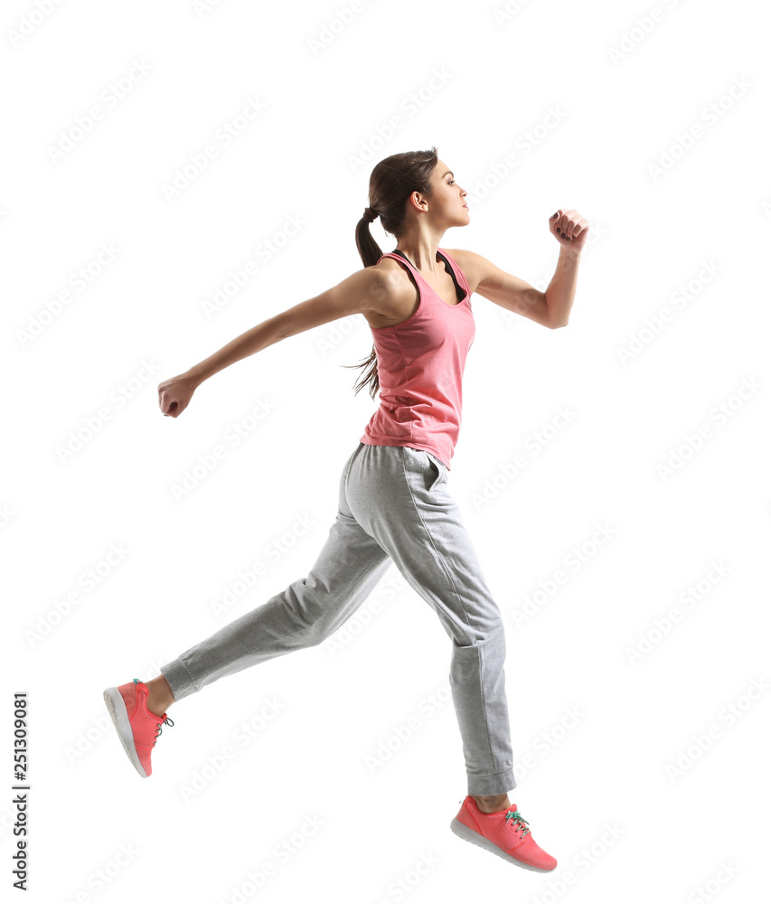 Sporty young woman running against white background