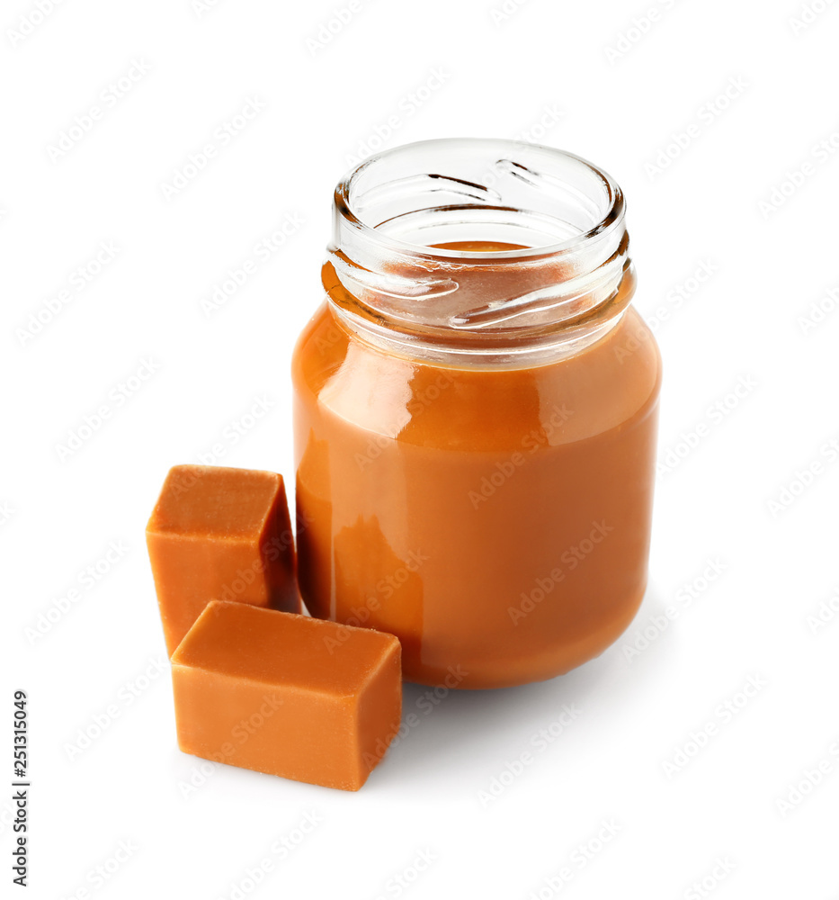 Jar with sweet liquid caramel on white background