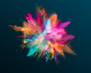 Colored powder explosion on dark gradient background. Freeze motion.