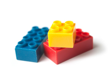 closeup of plastic bricks construction on white background