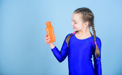 Kid cute girl gymnast sports leotard hold bottle for drink. Water balance and hard gym training. Drink more water. Keep water bottle with you. Quench thirst. Child feel thirst after sport training