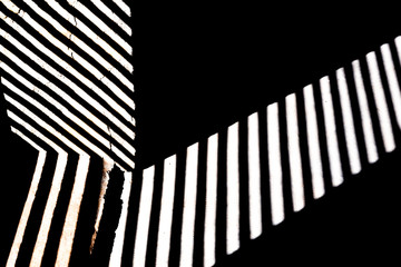 Wall Mural - lines and white stripes on black background with stone texture, copy space.