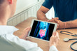 Doctor holding a digital tablet with technology 3D x-ray of intestine of the patient. Digestion and transit prevention