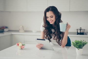 Sticker - Close up photo sweet beautiful brunette she her lady homey indoors housewife watch e-reader hold beverage read reader glad wearing domestic home apparel clothes outfit comfy table kitchen