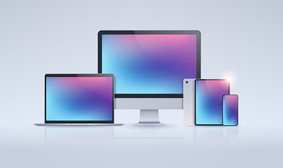 Wall Mural - electronic devices mockup set laptop monitor tablet and smartphone with colorful screen digital tech