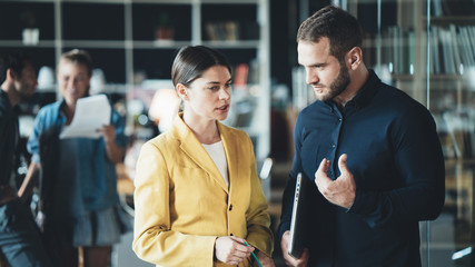 Man and woman employees have meeting in the office. Daily business situations