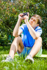 Wall Mural - Young Man with a Camera