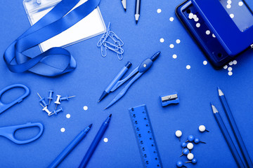 Sticker - School supplies on blue background. Minimalism concept