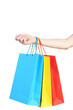 © 5second - Female hand holding colorful shopping bags on white background