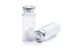 Bottles for injection with white powder on a white background