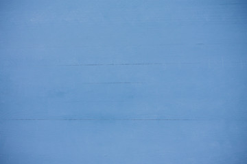 Light blue textured wooden background, painted. washed wood style