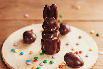 Chocolate Easter rabbit on wooden background. Easter concept