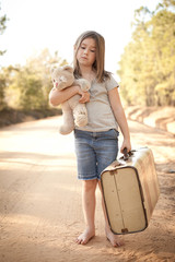 Wall Mural - Little Girl with Ragged Teddybear and Suitcase - Poverty, Homelessness, Runaway Child