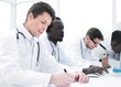 © ASDF - group of doctors working in the hospital laboratory
