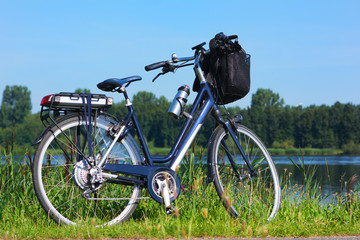 Wall Mural - E-bike in nature landscape