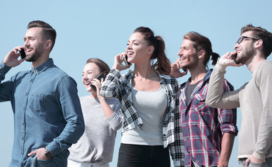 Canvas Print - closeup of a group of young people with smartphones.