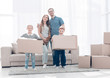 © ASDF - family moves the boxes to a new apartment.
