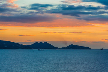 Wall Mural - Hills and Ships Against a Tropical Sunrise in the Caribbean