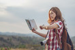 © geargodz - tourist woman looking a wrist watch and location map