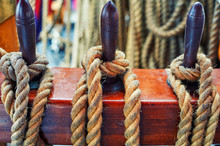 Close-up Of Mooring Rope Tied Around The Bollard By Boat Or Ship