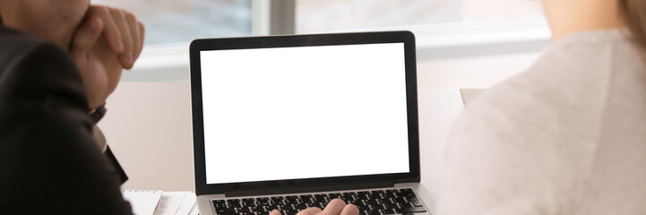 Horizontal image colleagues working on laptop with mockup blank screen
