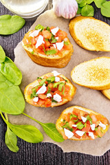 Wall Mural - Bruschetta with tomato and cheese on board top