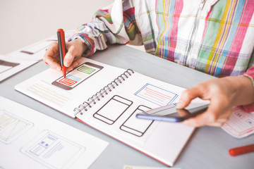 Wall Mural - designing application for mobile phone. the specialist creates a prototype user experience interface