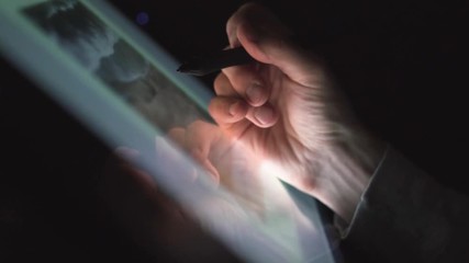 Wall Mural - digital artist photographer working on tablet pc from night home office
