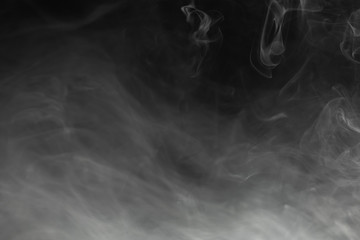 Wall Mural - dense smoke on black background