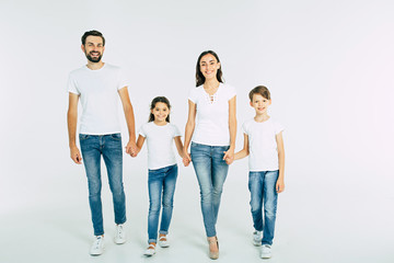 Full length photo of happy beautiful family isolated on white background in T-shirt