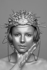 Wall Mural - Futuristic woman in metal helmet with screws, nuts and chains