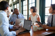 © Monkey Business - Business Team Having Informal Meeting Around Table In Coffee Shop