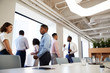 © Monkey Business - Group Of Business Colleagues Chatting In Office After Meeting
