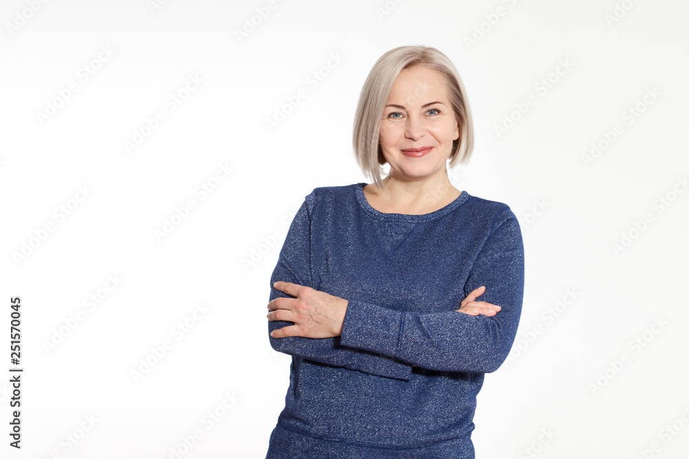 Attractive middle aged woman with folded arms on white background Stock ...