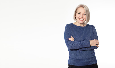 Wall Mural - attractive middle aged woman with folded arms on white background